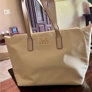 Lulu Tote bag brand new. Cream with gold zipper and one inner pocket